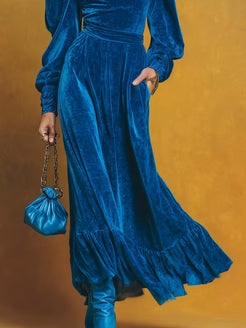 Retro-style velvet maxi dress with open neckline and puff hem