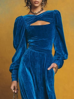 Retro-style velvet maxi dress with open neckline and puff hem